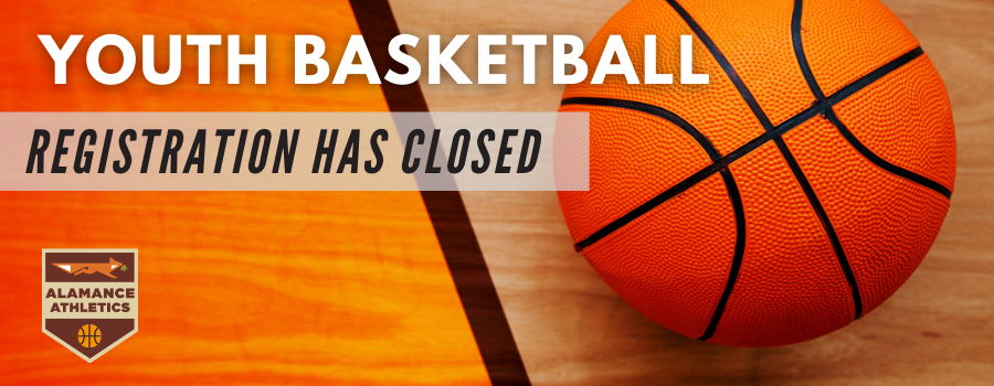 Image of a basketball on wooden gym floor