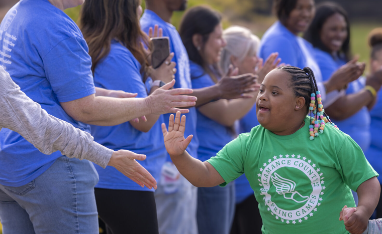 Special Olympics Athlete Giving a High Five
